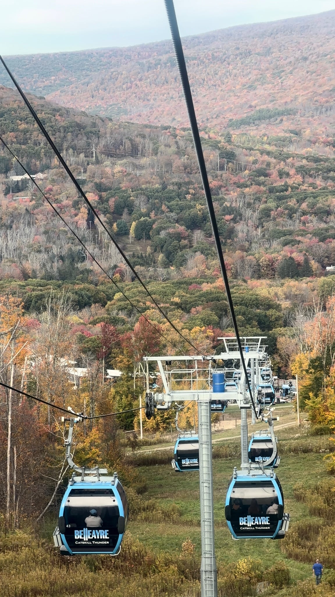 Belleayre gondola cabins going up the mountain over fall foliage